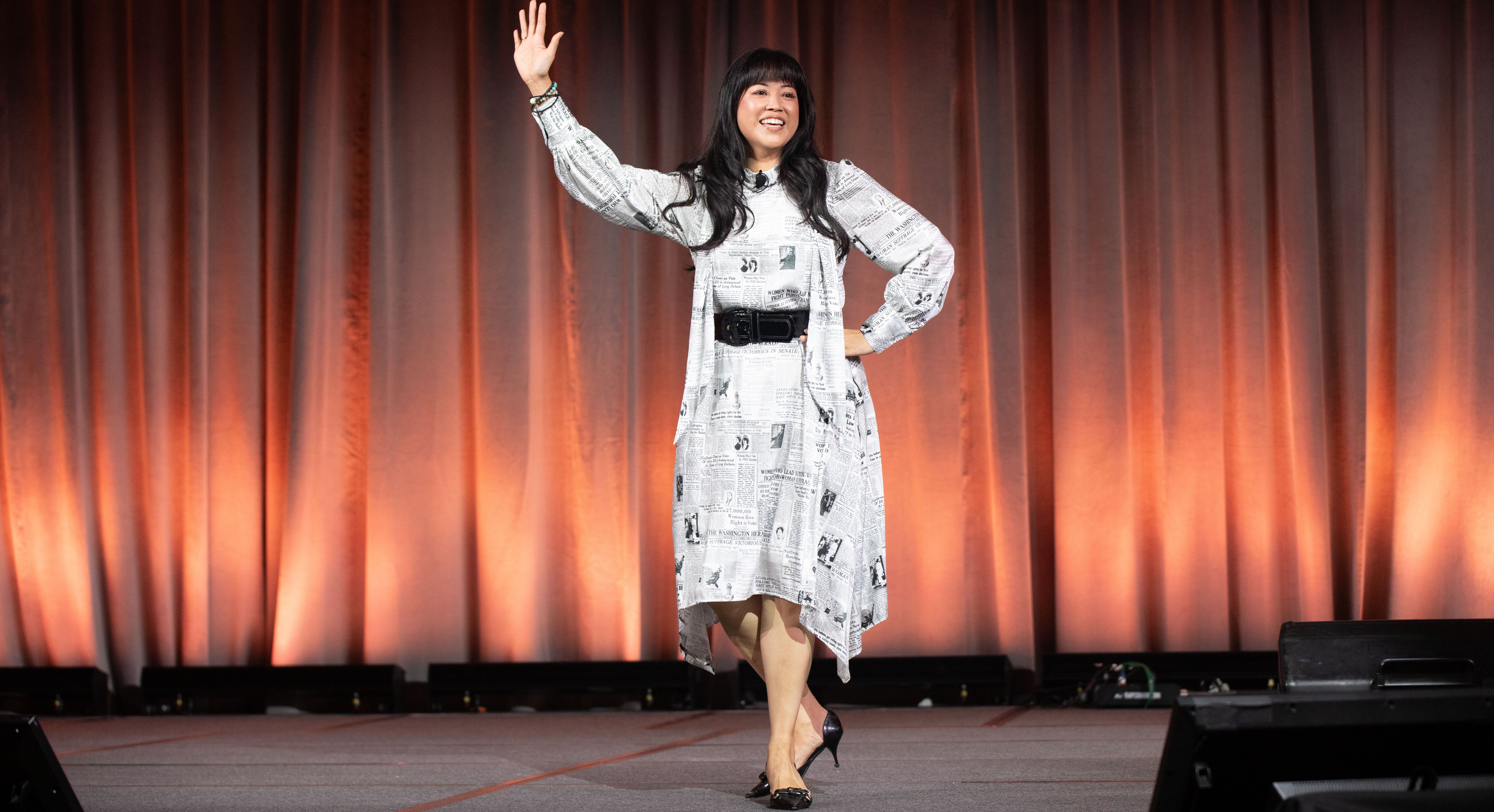 2024 Honoree Lisa Sun waving on stage