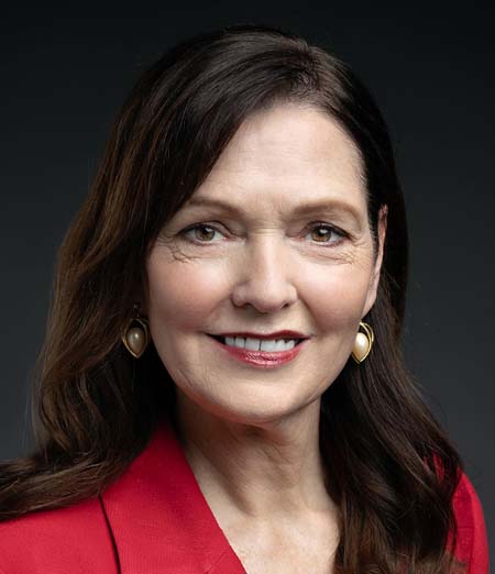 Woman smiling in red jacket